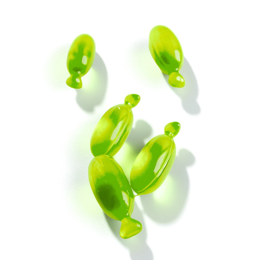 green capsules of vegan hair oil for nourishing and shine treatment