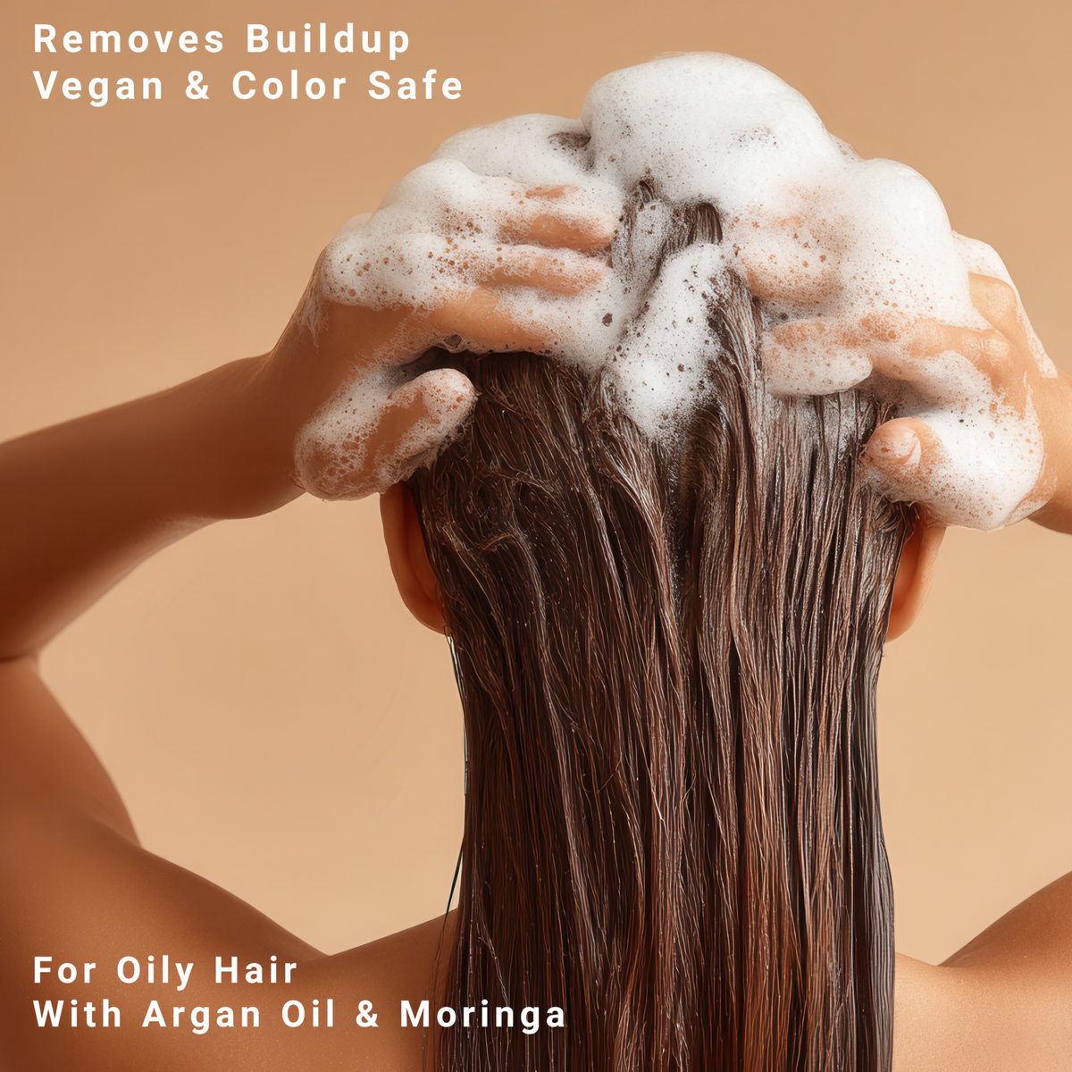Person washing oily hair with foamy Super Concentrated PROWASH Vegan Shampoo containing argan oil and moringa