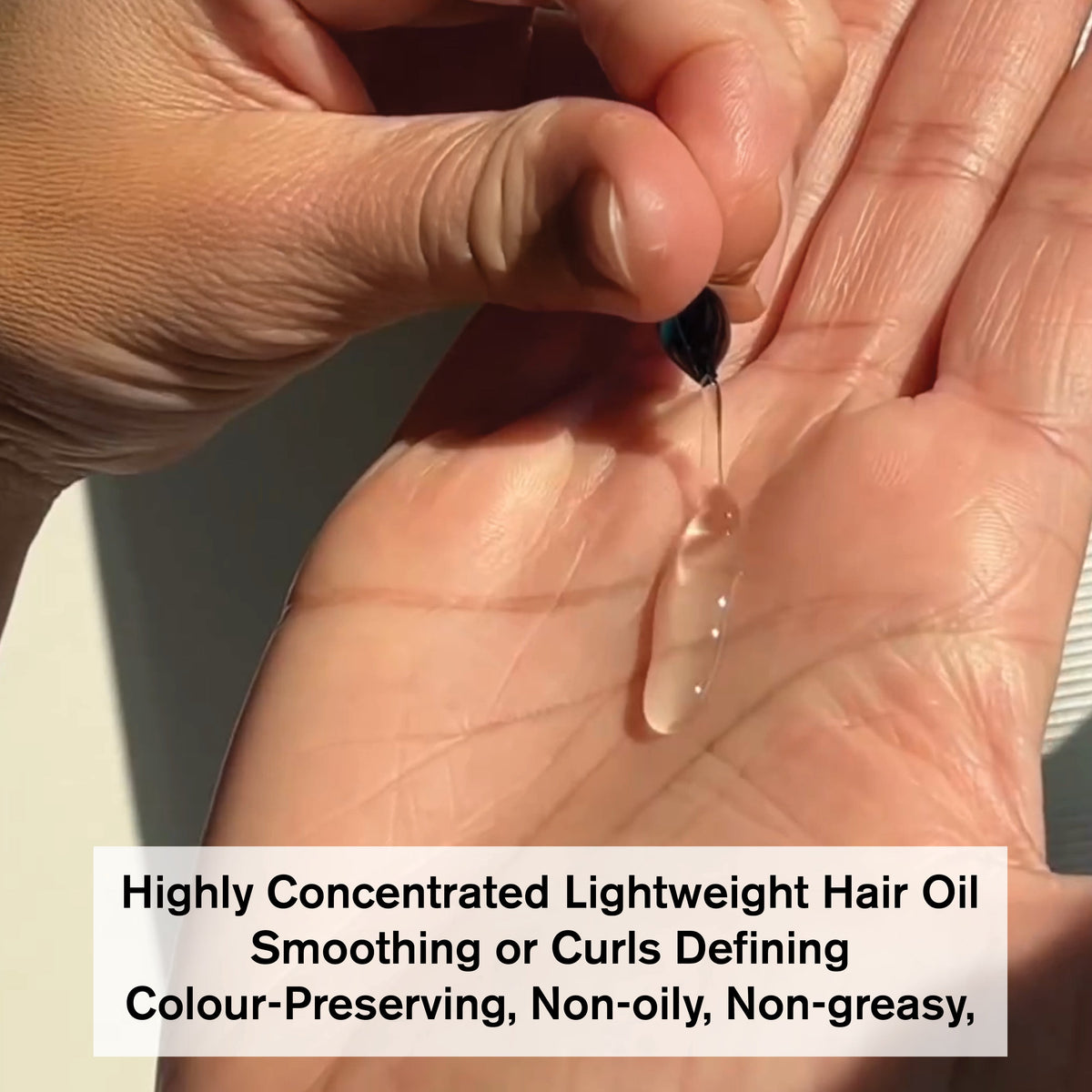Drop of VICE-VERSA LISS & CURLS Vegan Hair Oil on hand, lightweight and non-greasy for curls and smooth hair