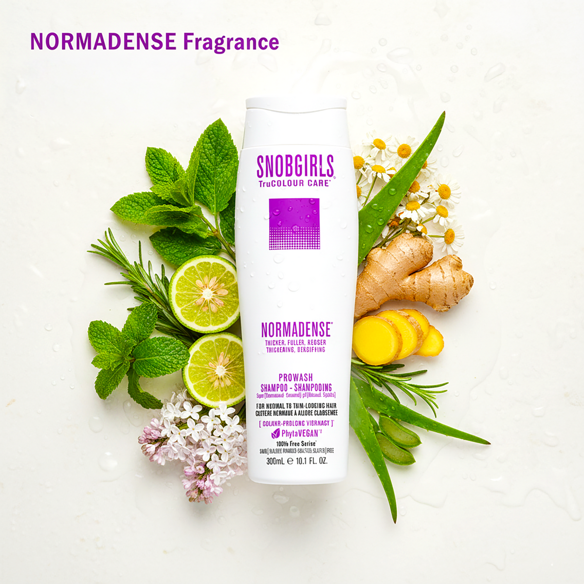 Bottle of Normadense 1 vegan hair conditioner surrounded by fresh herbs and citrus ingredients