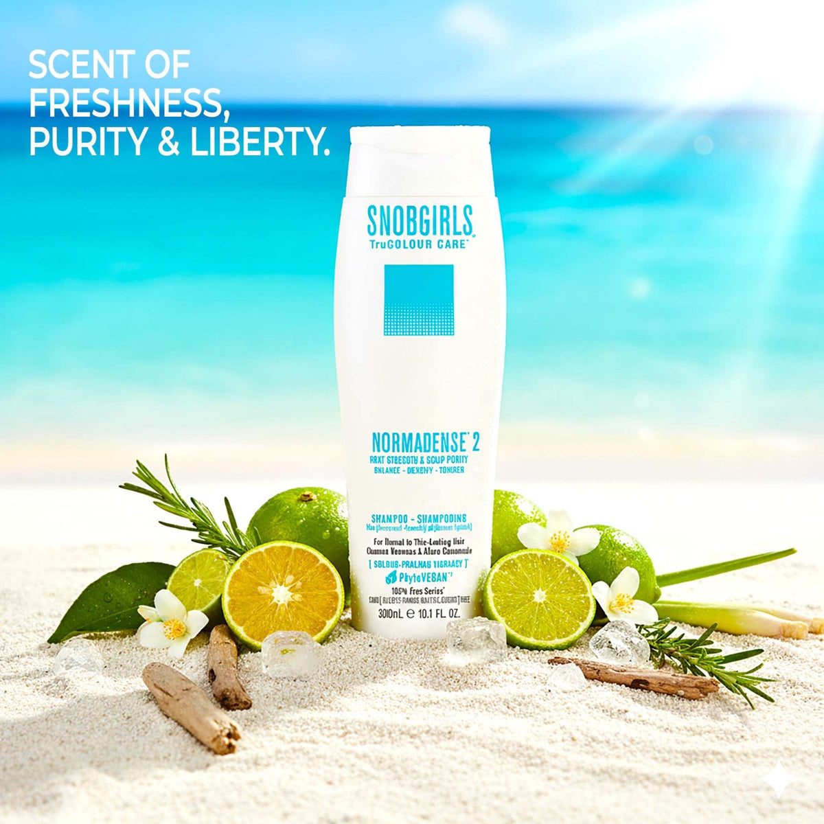 NORMADENSE 2 Vegan Shampoo bottle on beach sand surrounded by citrus fruits and green leaves for fuller, denser hair care