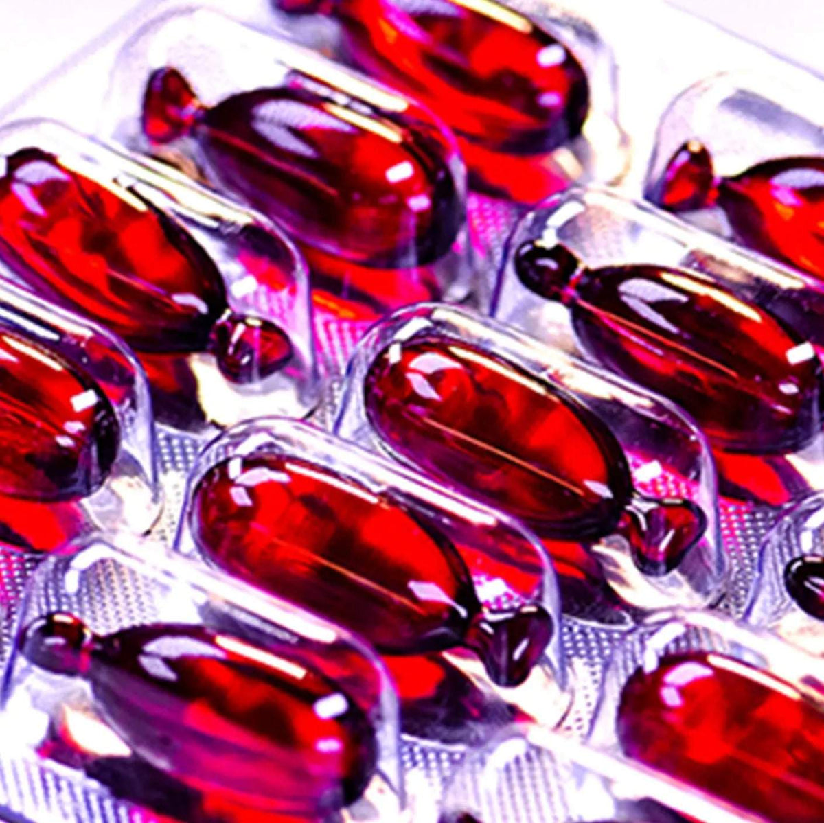 close-up of CURALIGN Vegan Hair Oil capsules in blister pack for hair smoothing and frizz control